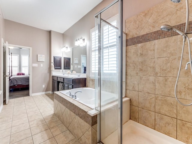 full bathroom with a stall shower, vanity, tile patterned floors, ensuite bathroom, and tiled bath