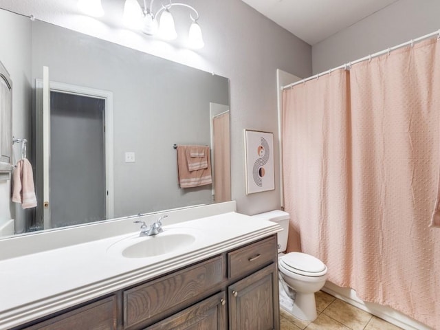 full bathroom with tile patterned flooring, toilet, and vanity