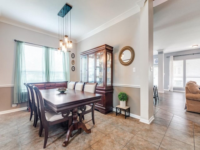 dining room featuring baseboards, ornamental molding, light tile patterned floors, and a notable chandelier