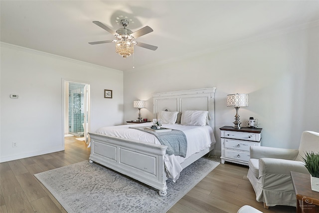 bedroom featuring ornamental molding, wood finished floors, ceiling fan, and baseboards