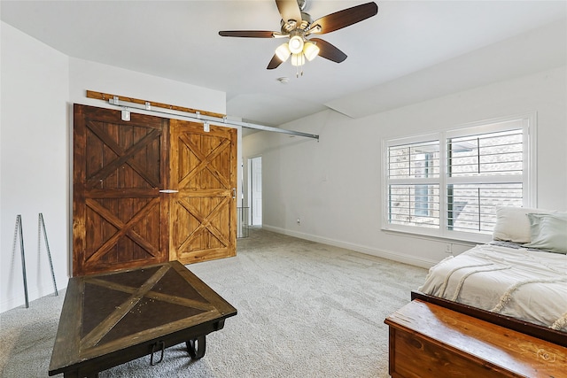 bedroom with light colored carpet, baseboards, and a ceiling fan