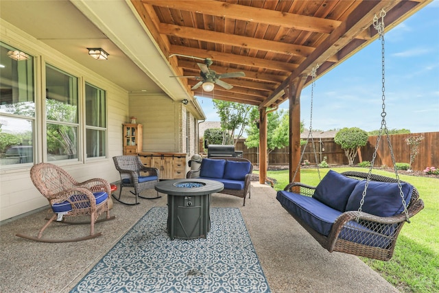 view of patio / terrace featuring an outdoor living space with a fire pit and a ceiling fan