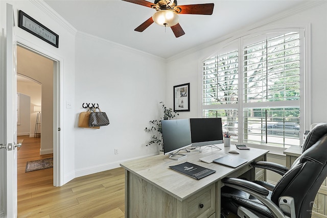 office area featuring ceiling fan, light wood-style floors, plenty of natural light, ornamental molding, and baseboards