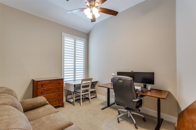 office area with carpet flooring, ceiling fan, vaulted ceiling, and baseboards