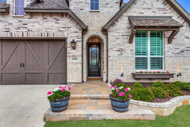 property entrance with an attached garage and driveway