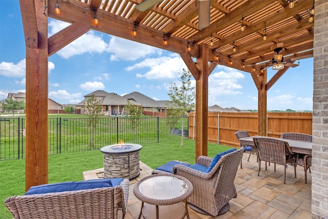 view of patio / terrace featuring a fenced backyard, a ceiling fan, a pergola, and a fire pit