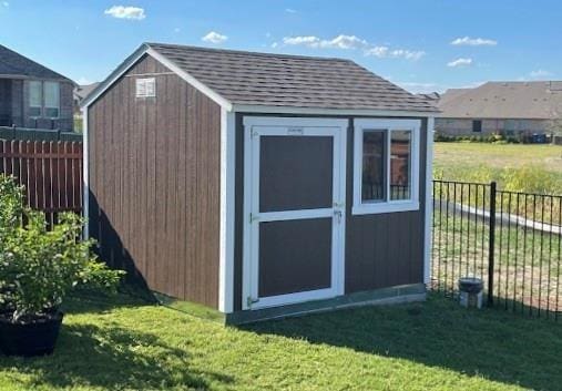 view of shed featuring a fenced backyard
