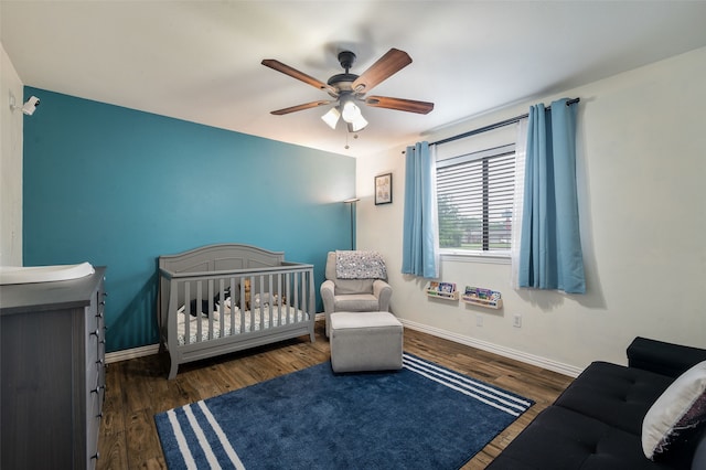 1600 Skyview Dr, Irving, TX 75060 - bedroom with baseboards, ceiling fan, wood finished floors, and a crib