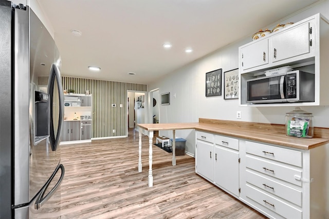 kitchen featuring light wood-style floors, recessed lighting, light countertops, white cabinetry, and appliances with stainless steel finishes