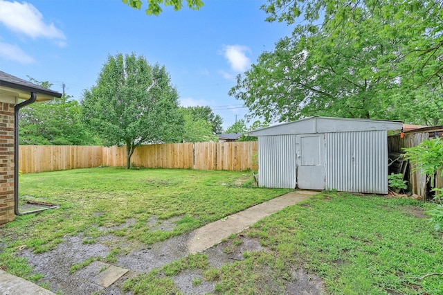 rear view of house featuring a fenced backyard, a patio, a lawn, and brick siding