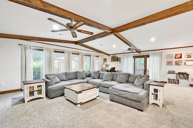 carpeted living area featuring vaulted ceiling with beams, ceiling fan, visible vents, and a healthy amount of sunlight