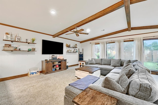 carpeted living area with baseboards, vaulted ceiling with beams, a ceiling fan, and a wealth of natural light