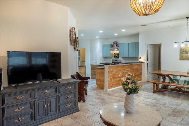living room featuring recessed lighting, light tile patterned floors, and a notable chandelier