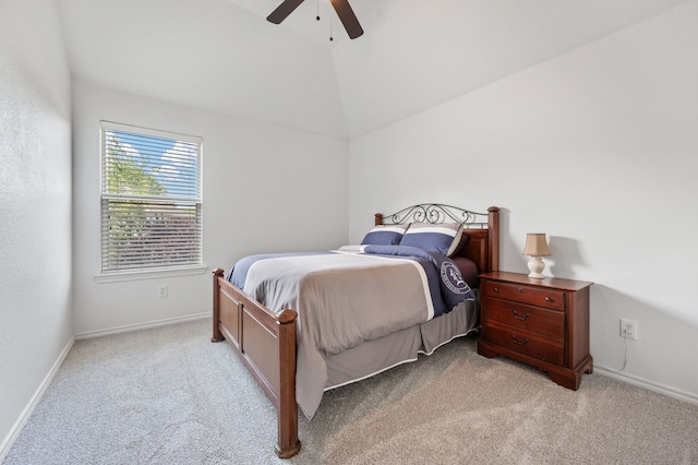 bedroom with baseboards, light carpet, ceiling fan, and lofted ceiling