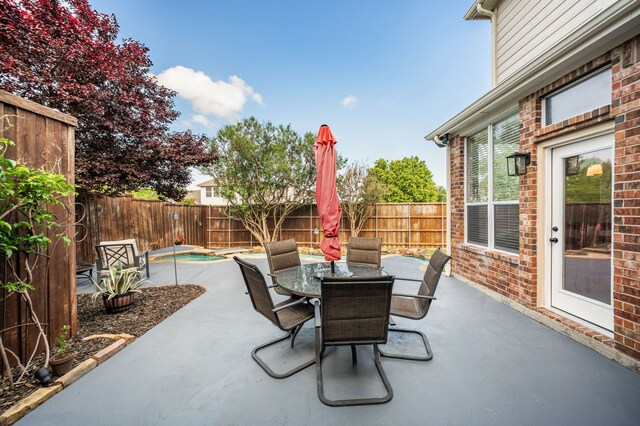 view of patio / terrace with a fenced backyard and outdoor dining space