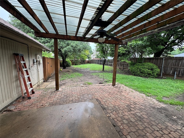 view of patio / terrace with a fenced backyard, ceiling fan, and a pergola