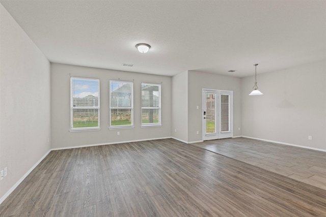 3819 Elkhorn Ln, Forney, TX 75126 - unfurnished room with wood finished floors and baseboards