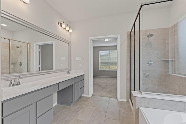3819 Elkhorn Ln, Forney, TX 75126 - bathroom with a stall shower, tile patterned flooring, double vanity, and baseboards