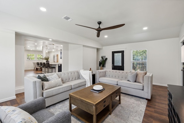 living room with ceiling fan, dark wood-style flooring, visible vents, baseboards, and recessed lighting