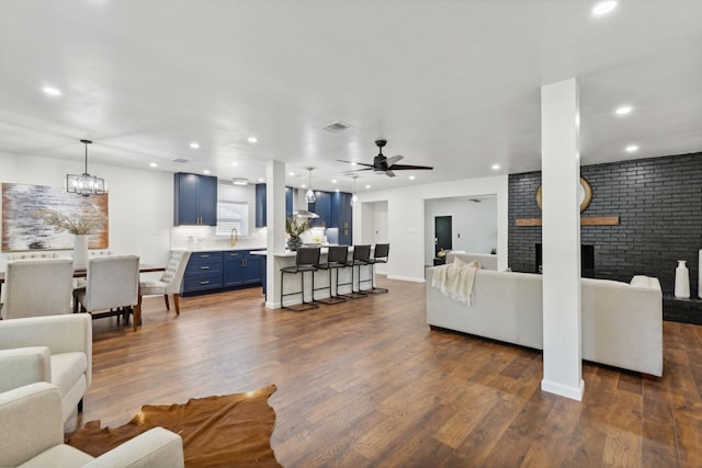 2008 Custer Pkwy, Richardson, TX 75080 - living room featuring a fireplace, dark wood-style floors, recessed lighting, and ceiling fan