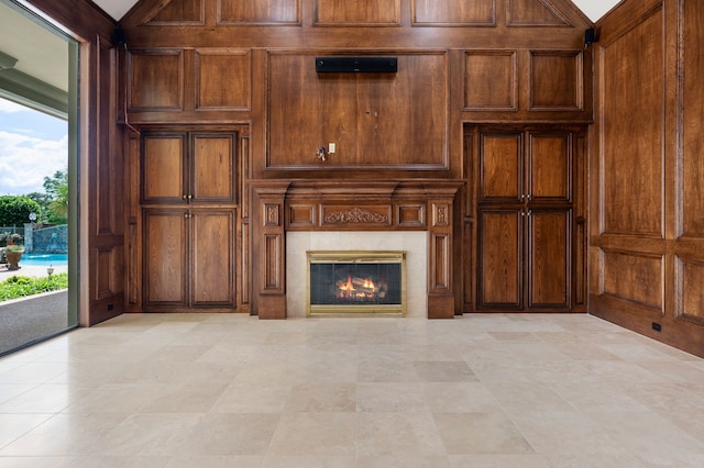 5404 Miramar Ln, Colleyville, TX 76034 - unfurnished living room with wooden walls and a fireplace