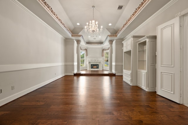 5404 Miramar Ln, Colleyville, TX 76034 - unfurnished living room featuring decorative columns, dark wood-style flooring, a tray ceiling, ornamental molding, and a chandelier