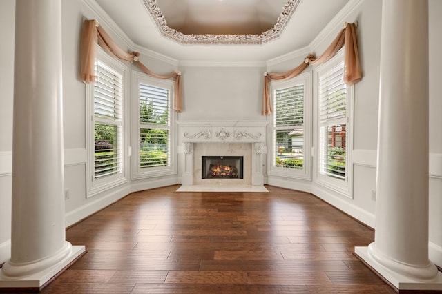 5404 Miramar Ln, Colleyville, TX 76034 - unfurnished living room featuring decorative columns, healthy amount of natural light, a high end fireplace, wainscoting, and ornamental molding