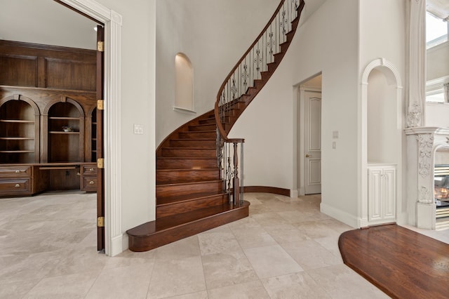 5404 Miramar Ln, Colleyville, TX 76034 - staircase with a towering ceiling, baseboards, and tile patterned flooring