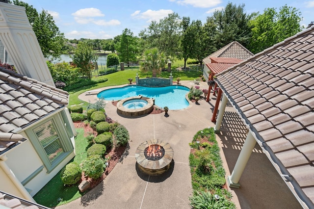5404 Miramar Ln, Colleyville, TX 76034 - view of swimming pool with a patio area, a water view, a fenced backyard, and a pool with connected hot tub