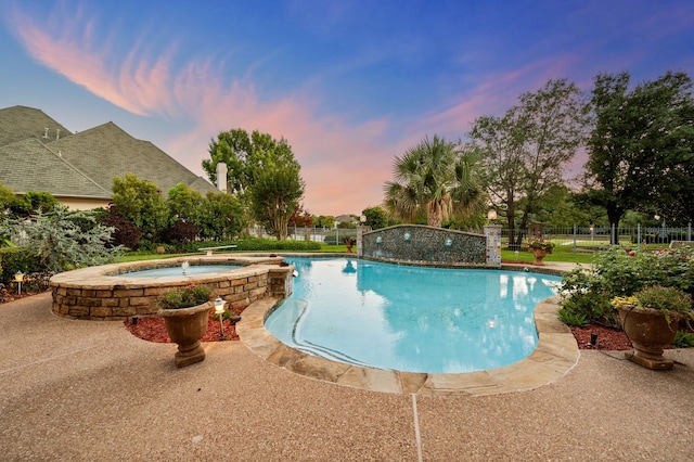 5404 Miramar Ln, Colleyville, TX 76034 - pool at dusk featuring a pool with connected hot tub
