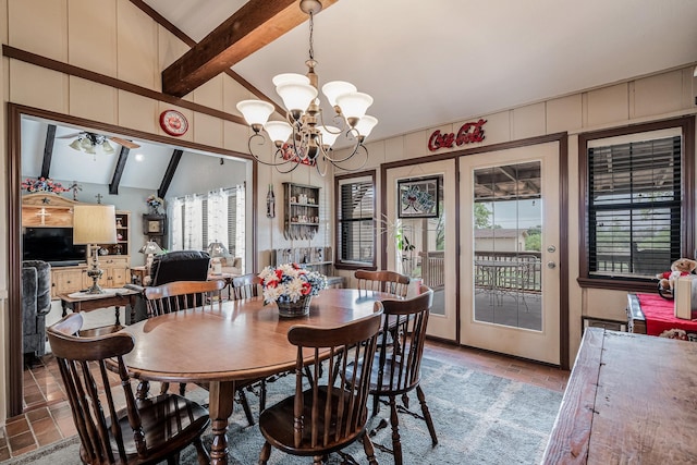 dining area with an inviting chandelier, high vaulted ceiling, and beam ceiling