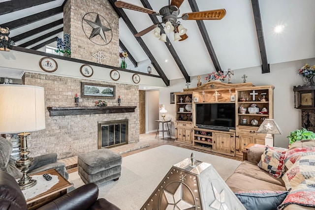 living room with high vaulted ceiling, ceiling fan, a fireplace, and beam ceiling