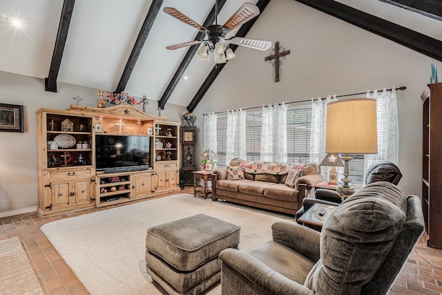 living room featuring baseboards, a ceiling fan, high vaulted ceiling, and beamed ceiling