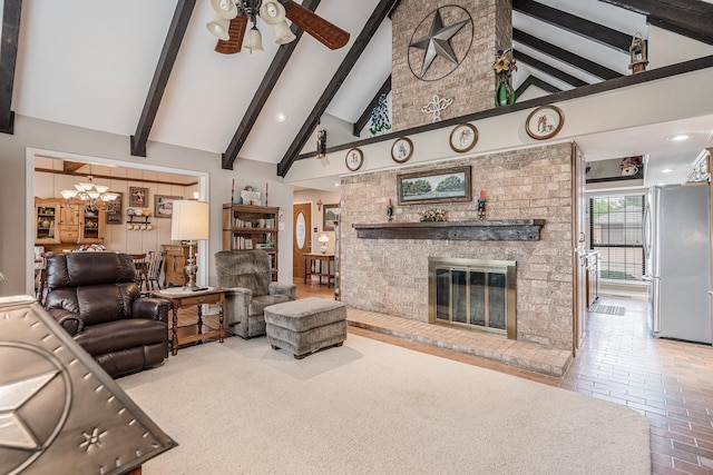 living area with a brick fireplace, beam ceiling, high vaulted ceiling, brick floor, and ceiling fan with notable chandelier