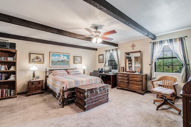 bedroom featuring a textured ceiling, ceiling fan, beam ceiling, and light carpet