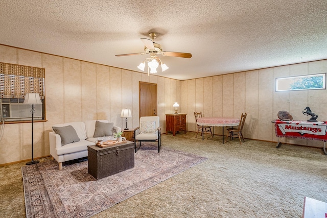 living area featuring a ceiling fan, a textured ceiling, carpet, and cooling unit