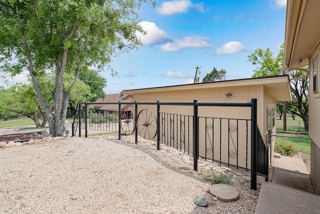 view of gate featuring fence