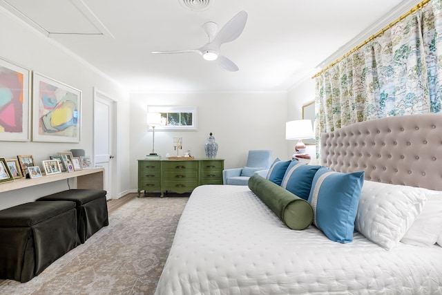 bedroom featuring crown molding, ceiling fan, attic access, wood finished floors, and visible vents