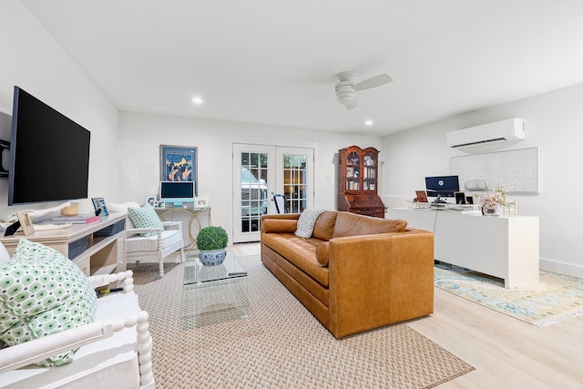 living area with a wall mounted air conditioner, recessed lighting, french doors, a ceiling fan, and light wood-style flooring