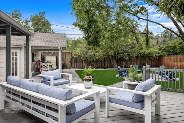 deck featuring a yard, an outdoor hangout area, and a fenced backyard