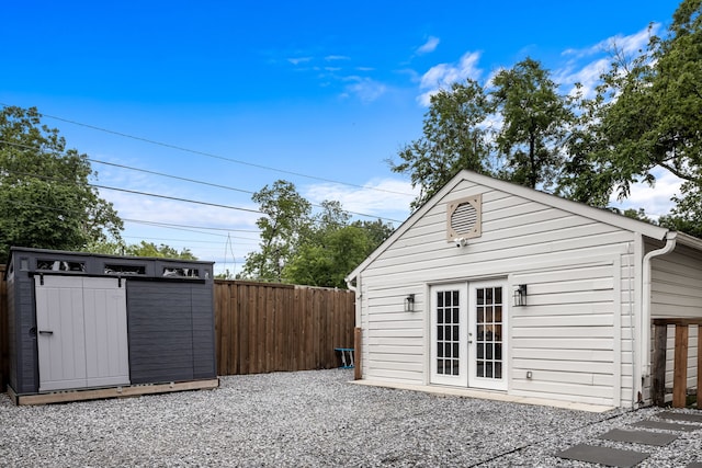 exterior space featuring french doors and fence