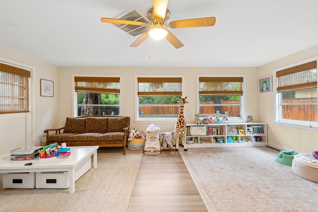 playroom featuring ceiling fan and wood finished floors