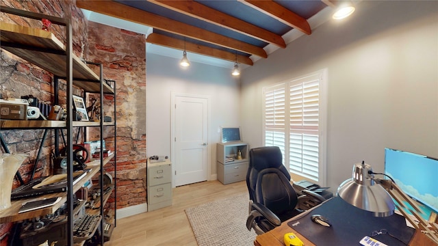 office space featuring beamed ceiling and light wood-style flooring