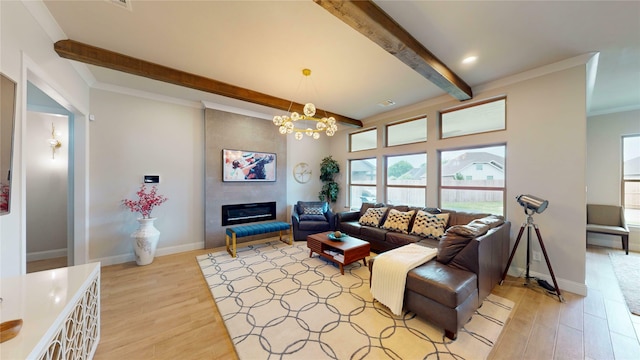 living area featuring light wood-type flooring, an inviting chandelier, a fireplace, and beamed ceiling
