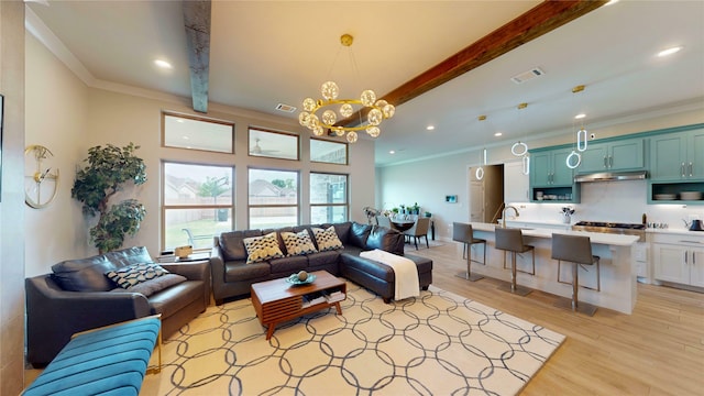 living room with crown molding, beamed ceiling, visible vents, and an inviting chandelier