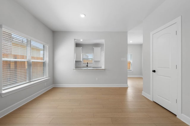 1203 Dye Blvd, Princeton, TX 75407 - interior space with a sink, baseboards, recessed lighting, and light wood-style flooring