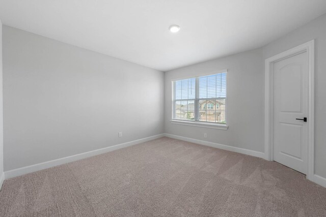 1203 Dye Blvd, Princeton, TX 75407 - spare room with baseboards and light carpet