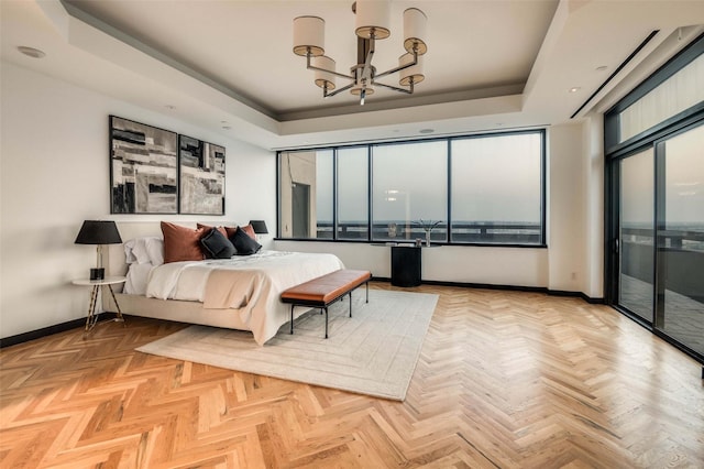 3111 Welborn St Unit 1703, Dallas, TX 75219 - bedroom with baseboards, an inviting chandelier, access to exterior, and a tray ceiling