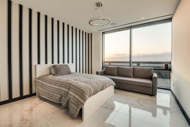 3111 Welborn St Unit 1703, Dallas, TX 75219 - bedroom featuring a wall of windows, baseboards, wallpapered walls, and marble finish floor
