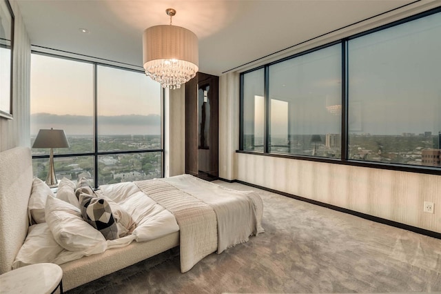 3111 Welborn St Unit 1703, Dallas, TX 75219 - bedroom with carpet floors, floor to ceiling windows, and a notable chandelier